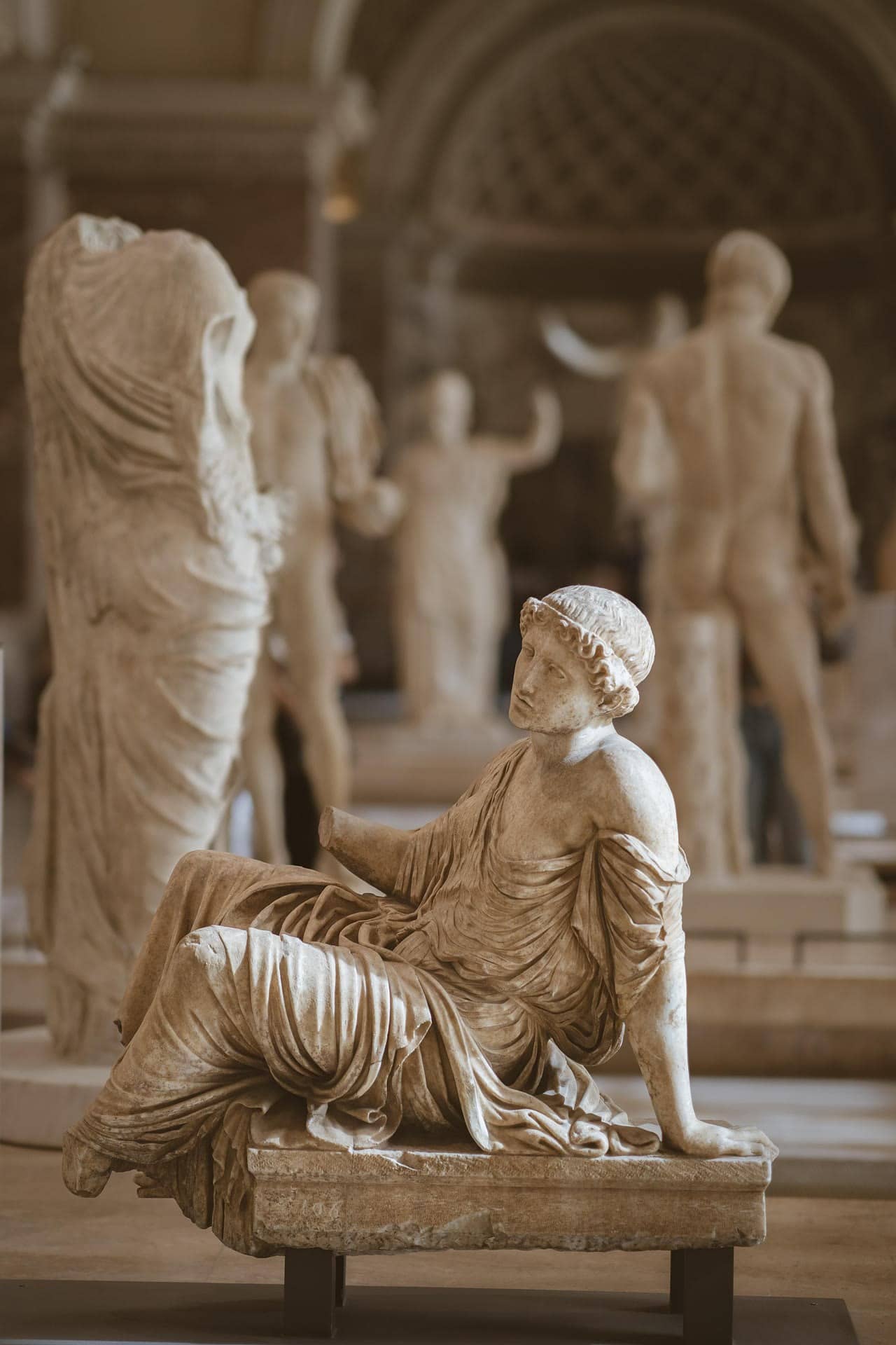 Classical sculptures in the Louvre’s galleries